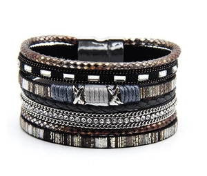 Detail of multi-layer handmade woven bracelet with magnetic clasp and rhinestones