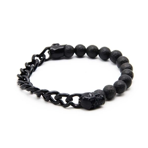 Men's matte black lava stone bead bracelet with metal skull and chain detail