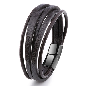Men's multi-layer braided brown leather bracelet with black magnetic clasp on white background