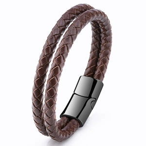 Detail shot of brown double-layer braided leather bracelet with black magnetic metal clasp