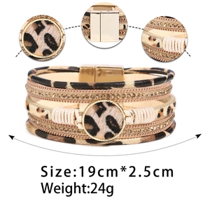 Detail showing the magnetic clasp and leopard print leather texture on the wrap bracelet