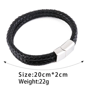 Detail showing double-strand black braided leather bracelet with silver magnetic buckle