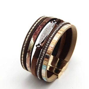 Macro detail of Bohemian multilayer leather bracelet with rhinestones and magnetic clasp