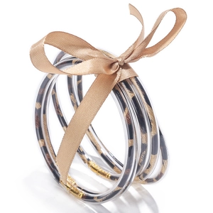 Set di tre bracciali in resina leopardata trasparente con un fiocco di nastro dorato