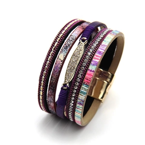 Detail of bohemian multilayer wrap bracelet with purple glitter leather and gold magnetic clasp