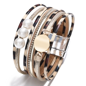 Detail view of Bohemian leopard print leather bracelet with pearls and magnetic clasp