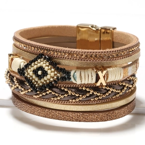 Bohemian multilayer wrap bracelet with rhinestones, beads and magnetic clasp on white background