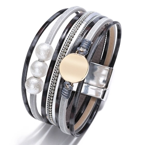 Detail of layered leather wrap bracelet with pearls and silver magnetic clasp