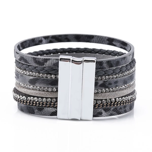 Detail of multi-layer leopard print leather bracelet with rhinestones and magnetic buckle