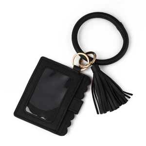Detail of black pebble leather card holder with clear ID window and wristlet ring