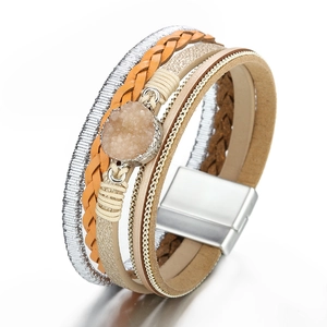 Detail of multi-layer woven leather bracelet featuring a druzy stone and magnetic clasp