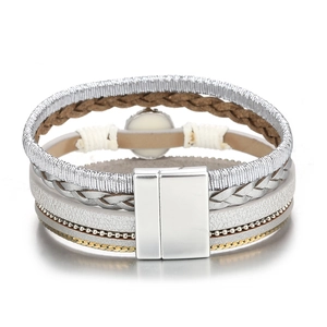 Detail of multi-layer braided leather bracelet with magnetic clasp and metal chains