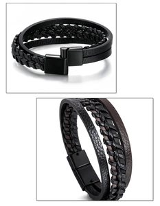 Close-up of black braided cord and leather multilayer bracelet with matte magnetic buckle