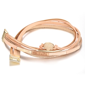 Detail of bohemian multilayer leather bracelet featuring pink bands and magnetic gold clasp