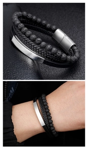 Macro detail of men's multi-layer bracelet with volcanic stone beads and woven leather