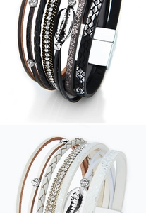 Close-up of bohemian multilayer shell bracelet with magnetic clasp and rhinestones