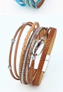 Detail view of Bohemian multi-layer leather bracelet with shell charm and magnetic clasp