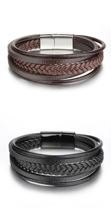 Detail of multi-layer braided leather bracelets in black and brown with magnetic clasp