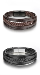 Close-up of multilayer braided leather bracelets with matte black and silver magnetic clasps