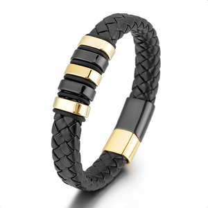 Etnische gevlochten zwart leren armband met goud en zwart stalen ringen voor heren