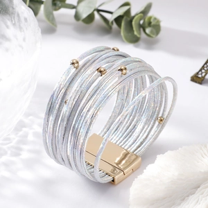 Detail of multi-layer grey leather wrap bracelet with gold beads and magnetic clasp