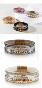 Detail view of multi-layer leather bracelets with rhinestone chains and magnetic clasps