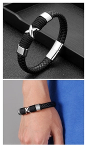 Macro shot of men's braided leather bracelet with polished silver X-shaped magnetic clasp