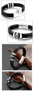 Close-up of double-layer black leather bracelet with carved silver skull and magnetic clasp