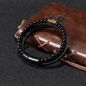 Bracciale multistrato da uomo con croce dorata su taccuino in pelle vintage
