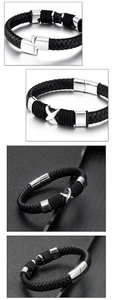 Detail of men's black woven leather bracelet with silver X-shaped magnetic clasp