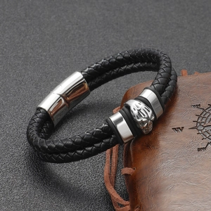 Men's vintage punk black braided leather bracelet with silver skull charm and magnetic clasp