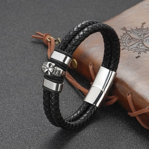 Men's double-layered black braided leather bracelet with silver skull charm and magnetic clasp