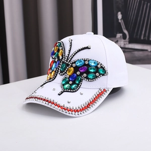 White baseball cap with colorful rhinestone butterfly and crystal rim detail