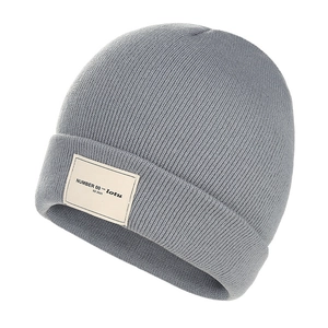 Stylish gray knit beanie for men and women with warm cuffed design and a street style woven label
