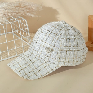 Elegant beige tweed baseball cap with rhinestone heart detail and golden metallic thread