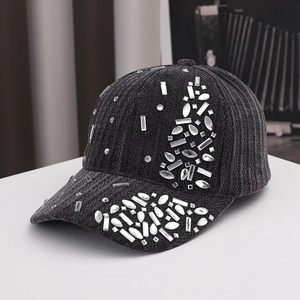 Detailed macro view of black corduroy baseball cap decorated with sparkling rhinestones