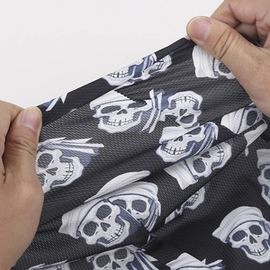 Detail showing high-stretch mesh fabric with skull print on breathable sports bandana