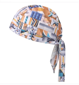 Detail of multi-color geometric print bandana cap with long-tail tie straps