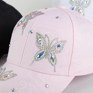 Women's baseball cap with rhinestone butterfly patterns in pink, black, and white colors