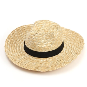 Handwoven wide-brim straw sun hat with black ribbon detail for outdoor farming and fishing