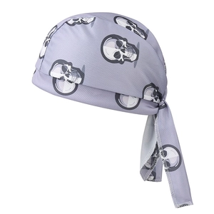 Detail of grey breathable mesh sports bandana with printed black and white skull patterns
