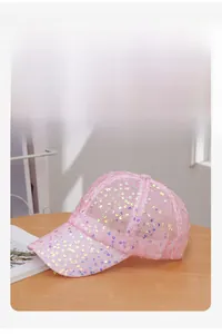 Detail of pink sequin baseball cap showing breathable mesh and wide sweatband interior