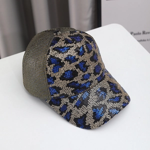 Detail of sequins leopard pattern on blue baseball cap with metallic mesh backing