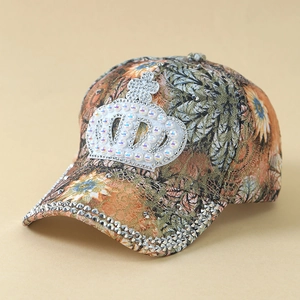 Detail of baseball cap with lace crown patch featuring rhinestones and pearls