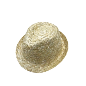 Macro shot showing the fine texture and detailed weave of the natural wheat straw sun hat