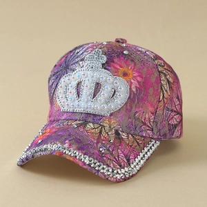 Detailed view of pink floral lace baseball cap with pearl crown and rhinestone brim
