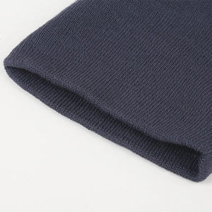 Close-up of dark blue ribbed knit fabric showing detailed texture and high elasticity