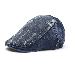 Classic dark blue denim newsboy cap with vintage distressed holes and adjustable buckle