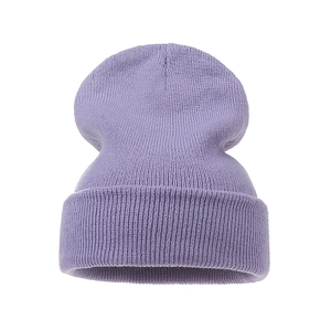Close-up of lilac purple knit beanie showing vertical ribbed texture and folded cuff