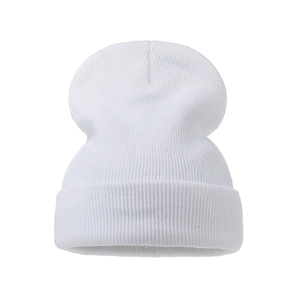 Close-up of white ribbed knit beanie featuring thick cuff and stretch texture